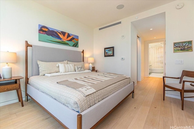 1118 Ala Moana Blvd Unit 2505, Honolulu, HI 96814 - bedroom featuring light wood-style flooring and recessed lighting
