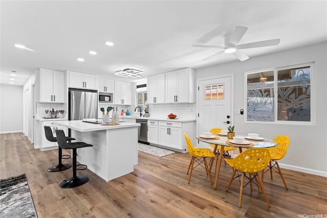 85-310 Kohai Pl, Waianae, HI 96792 - kitchen with stainless steel appliances, tasteful backsplash, baseboards, white cabinets, and light countertops