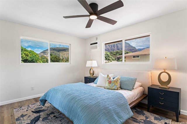 85-310 Kohai Pl, Waianae, HI 96792 - bedroom with multiple windows, wood finished floors, and baseboards