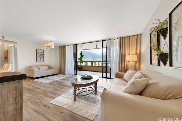 46-55 Meheanu Pl Unit 3441, Kaneohe, HI 96744 - living area featuring light wood-type flooring and a chandelier