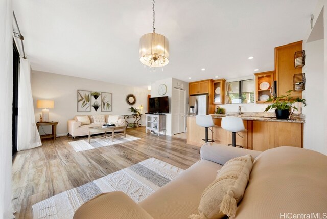 46-55 Meheanu Pl Unit 3441, Kaneohe, HI 96744 - living room with a chandelier, light wood-type flooring, recessed lighting, and baseboards