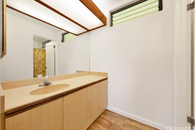46-55 Meheanu Pl Unit 3441, Kaneohe, HI 96744 - bathroom with wood finished floors, vanity, and baseboards