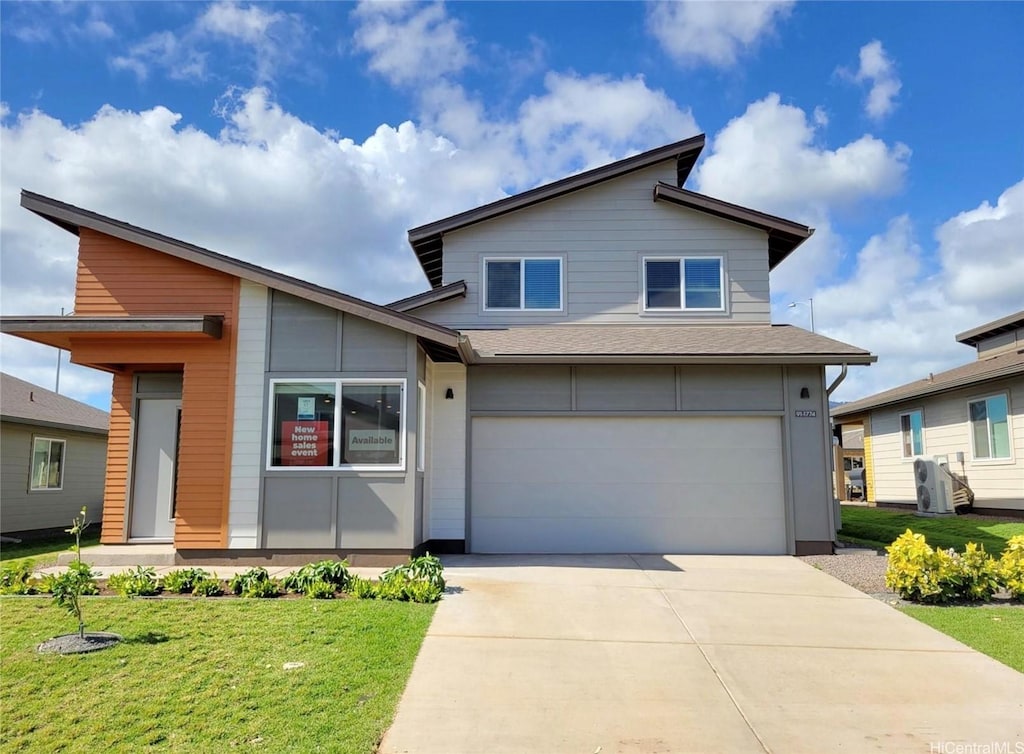 91-1774 Kohanahana Loop, Ewa Beach, HI 96706 - contemporary house with a garage, driveway, and a front yard