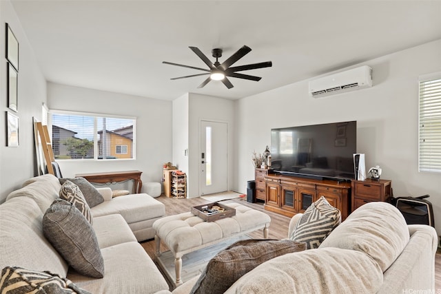 91-1774 Kohanahana Loop, Ewa Beach, HI 96706 - living area with a wall mounted air conditioner, a ceiling fan, wood finished floors, and plenty of natural light
