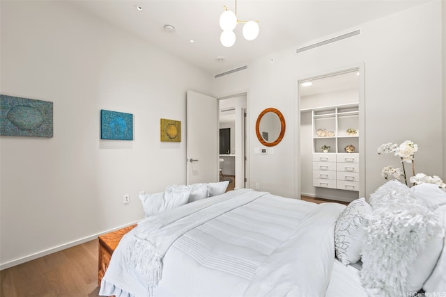 1388 Ala Moana Blvd Unit 5603, Honolulu, HI 96814 - bedroom featuring wood finished floors and a chandelier