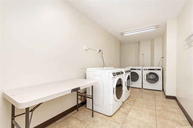 747 Amana St Unit 1607, Honolulu, HI 96814 - communal laundry room featuring washing machine and dryer and baseboards
