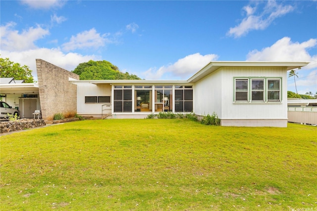 146 Kaluamoo St, Kailua, HI 96734 - rear view of house featuring a sunroom and a yard