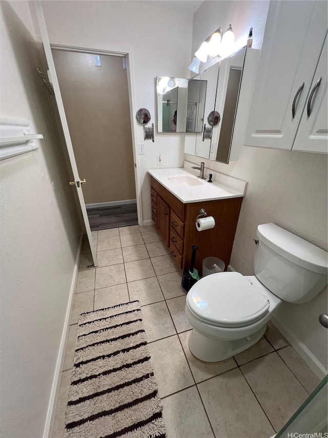 790 Ipuai St, Honolulu, HI 96825 - bathroom with toilet, vanity, tile patterned floors, and baseboards