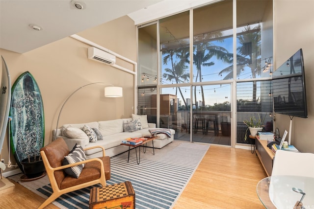 666 Prospect St Unit I208, Honolulu, HI 96813 - living room featuring an AC wall unit and wood finished floors