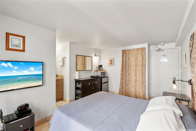 2463 Kuhio Ave Unit 607, Honolulu, HI 96815 - bedroom with connected bathroom and baseboards