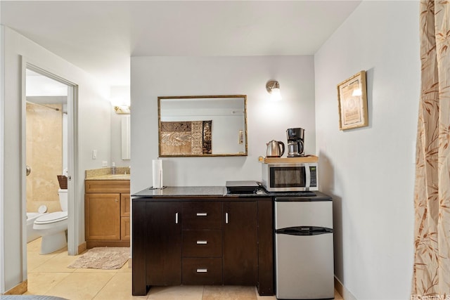 2463 Kuhio Ave Unit 607, Honolulu, HI 96815 - full bathroom with vanity, toilet, tile patterned flooring, and a shower with curtain