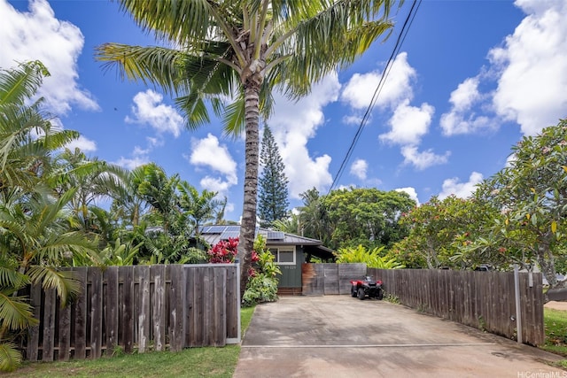 59-029 Huelo St, Haleiwa, HI 96712 - view of patio featuring a gate, a fenced front yard, and concrete driveway