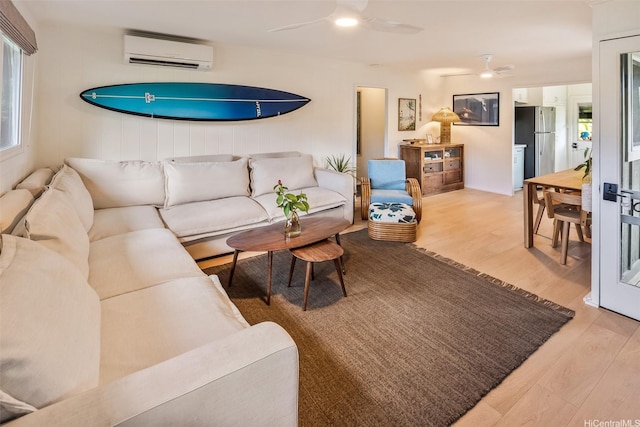 59-029 Huelo St, Haleiwa, HI 96712 - living area featuring a wall mounted air conditioner, wood finished floors, and ceiling fan
