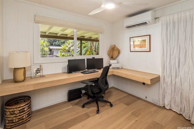 59-029 Huelo St, Haleiwa, HI 96712 - office area with a wall unit AC, light wood-style floors, ceiling fan, and built in desk