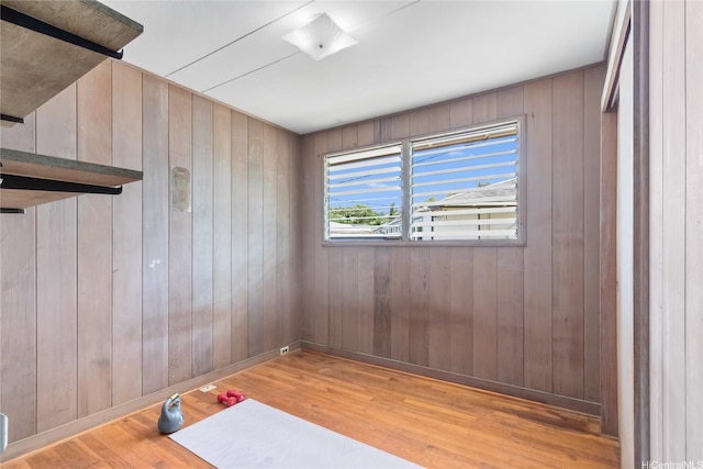 45-258 Halemuku Pl, Kaneohe, HI 96744 - workout area featuring light wood-style flooring, wood walls, and baseboards
