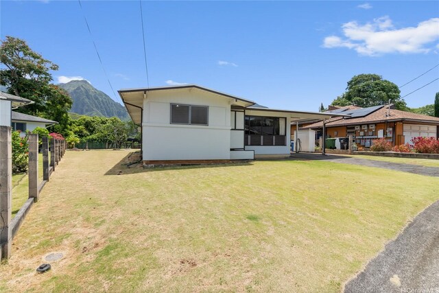 45-258 Halemuku Pl, Kaneohe, HI 96744 - view of front facade featuring driveway, a mountain view, and a carport