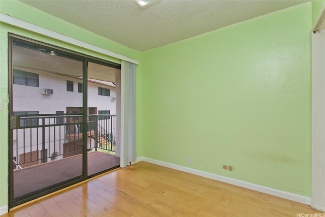 98-364 Kaonohi St Unit 11386, Aiea, HI 96701 - spare room featuring wood-type flooring, baseboards, and a textured ceiling