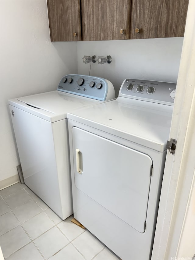 98-364 Kaonohi St Unit 11386, Aiea, HI 96701 - laundry room featuring independent washer and dryer, cabinet space, and light tile patterned floors
