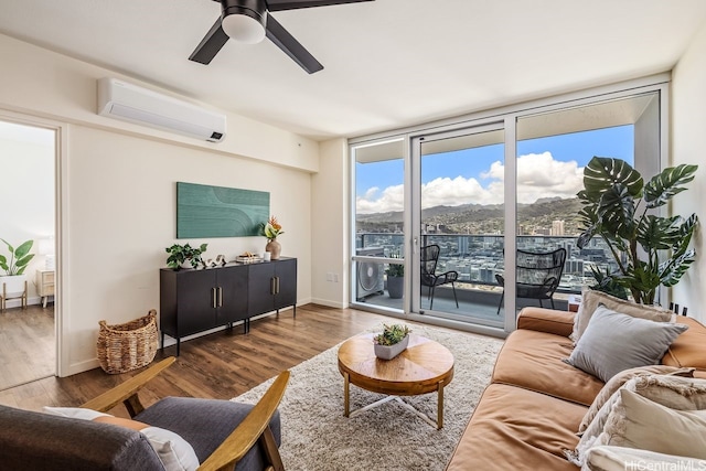 1391 Kapiolani Blvd Unit 3402, Honolulu, HI 96814 - living room featuring a wall mounted air conditioner, wood finished floors, a wall of windows, a ceiling fan, and baseboards