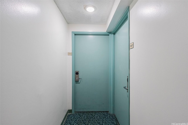444 Niu St Unit 3508, Honolulu, HI 96815 - doorway featuring a textured ceiling, carpet floors, and baseboards