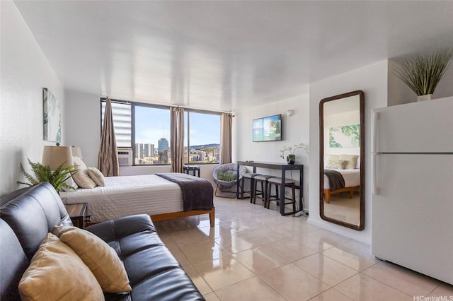 444 Niu St Unit 3508, Honolulu, HI 96815 - bedroom featuring freestanding refrigerator, light tile patterned floors, and cooling unit