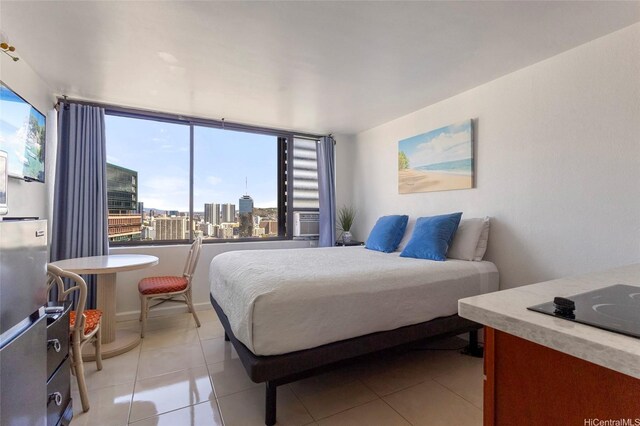 444 Niu St Unit 3508, Honolulu, HI 96815 - bedroom featuring light tile patterned floors and a view of city