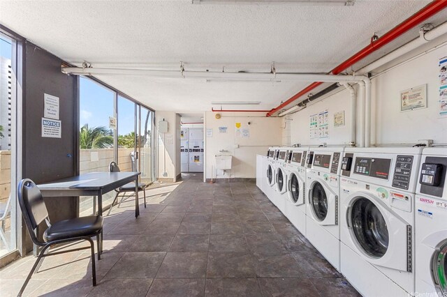 444 Niu St Unit 3508, Honolulu, HI 96815 - shared laundry with a textured ceiling and independent washer and dryer
