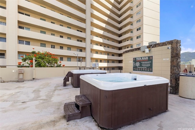 444 Niu St Unit 3508, Honolulu, HI 96815 - view of patio / terrace featuring a hot tub