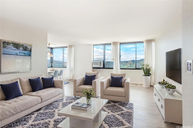 343 Hobron Ln Unit 4302, Honolulu, HI 96815 - living area featuring light wood-type flooring and cooling unit