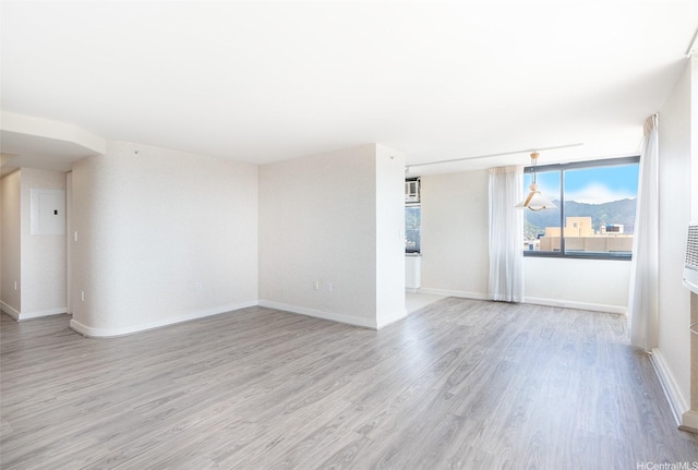 343 Hobron Ln Unit 4302, Honolulu, HI 96815 - unfurnished room featuring light wood-style flooring and baseboards