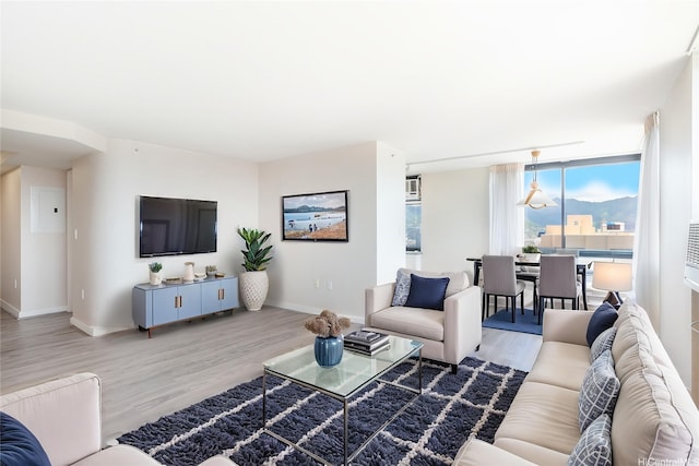 343 Hobron Ln Unit 4302, Honolulu, HI 96815 - living room featuring wood finished floors and baseboards