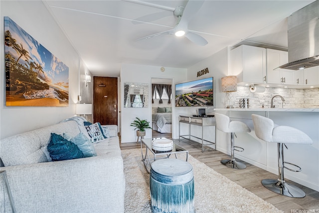 1002 S Kihei Rd Unit 205, Kihei, HI 96753 - living room featuring light wood-type flooring and a ceiling fan