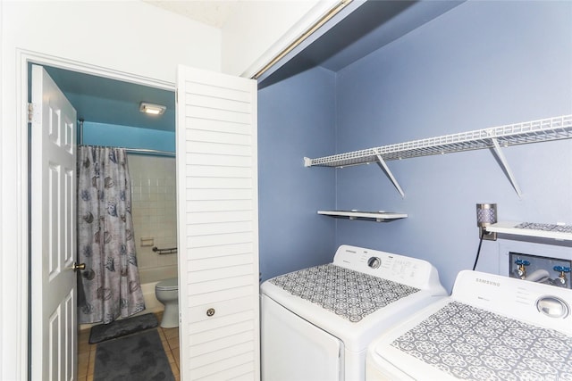 47-718 Hui Kelu St Unit 1504, Kaneohe, HI 96744 - washroom featuring washing machine and clothes dryer and tile patterned floors