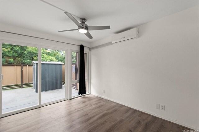 47-730 Hui Kelu St Unit 4404, Kaneohe, HI 96744 - unfurnished room featuring a wall unit AC, wood finished floors, ceiling fan, and baseboards