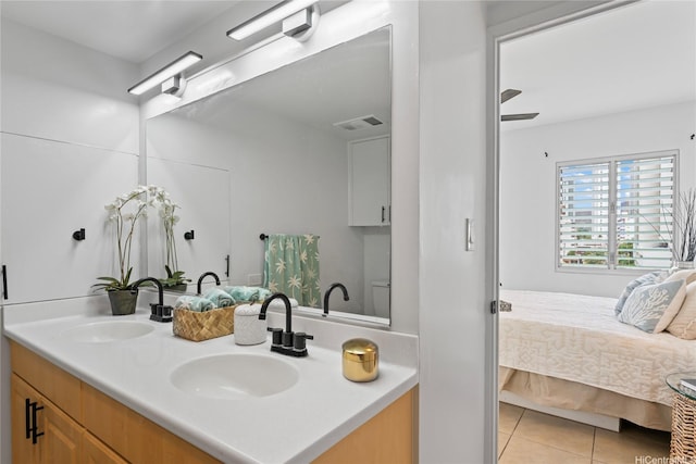 222 Kaiulani Ave Unit Ph3, Honolulu, HI 96815 - full bath featuring double vanity, tile patterned flooring, and connected bathroom