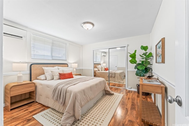 3037 Hinano St, Honolulu, HI 96815 - bedroom with a wall unit AC, wood finished floors, and a closet