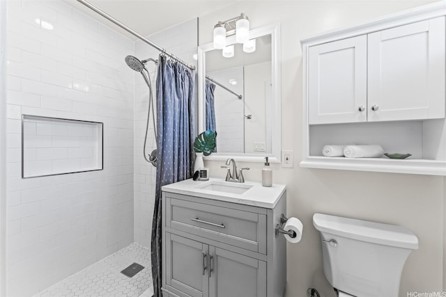 3037 Hinano St, Honolulu, HI 96815 - bathroom featuring toilet, a tile shower, and vanity