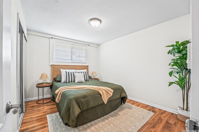 3037 Hinano St, Honolulu, HI 96815 - bedroom featuring baseboards and wood finished floors