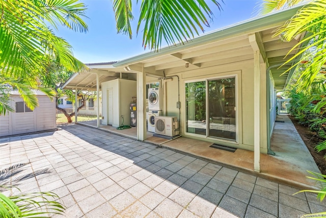 3037 Hinano St, Honolulu, HI 96815 - view of patio / terrace with stacked washer / drying machine and ac unit