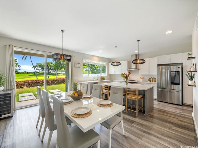 91-5408 Kapolei Pkwy Unit 37, Kapolei, HI 96707 - dining space with beverage cooler, recessed lighting, light wood-style floors, and a chandelier