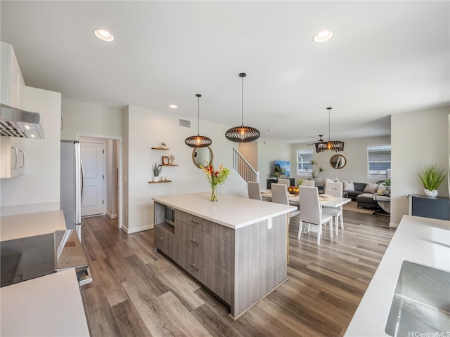 91-5408 Kapolei Pkwy Unit 37, Kapolei, HI 96707 - kitchen featuring modern cabinets, stainless steel appliances, a kitchen island, dark wood finished floors, and light countertops