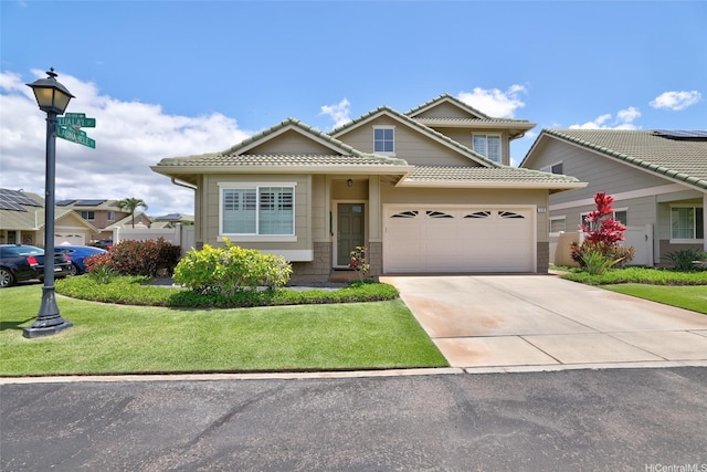 91-818 Lualai St Unit 69, Ewa Beach, HI 96706 - traditional-style house with an attached garage, concrete driveway, a front lawn, and a tiled roof