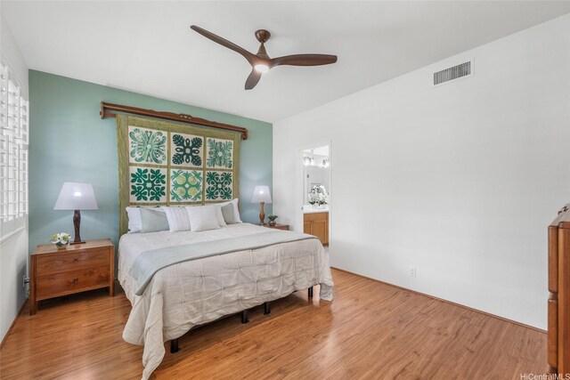 91-818 Lualai St Unit 69, Ewa Beach, HI 96706 - bedroom featuring wood finished floors, ceiling fan, and ensuite bath