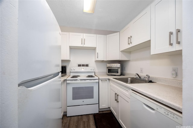 1600 Wilikina Dr Unit A403, Wahiawa, HI 96786 - kitchen featuring white appliances, white cabinets, light countertops, and dark wood-type flooring