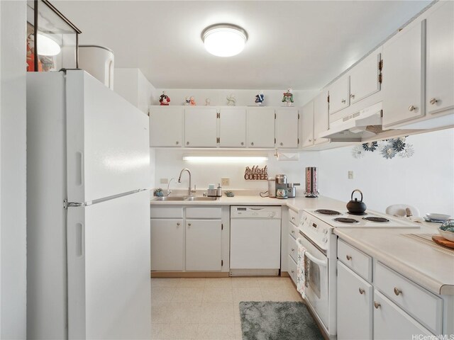 3045 Ala Napuaa Pl Unit 1416, Honolulu, HI 96818 - kitchen with white appliances, a sink, under cabinet range hood, white cabinets, and light countertops