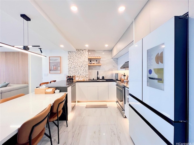 581 Kamoku St Unit 3906, Honolulu, HI 96826 - kitchen with appliances with stainless steel finishes, recessed lighting, backsplash, light marble finish floors, and modern cabinets