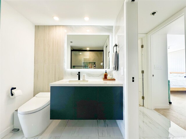 581 Kamoku St Unit 3906, Honolulu, HI 96826 - ensuite bathroom featuring marble look tiles, vanity, and toilet