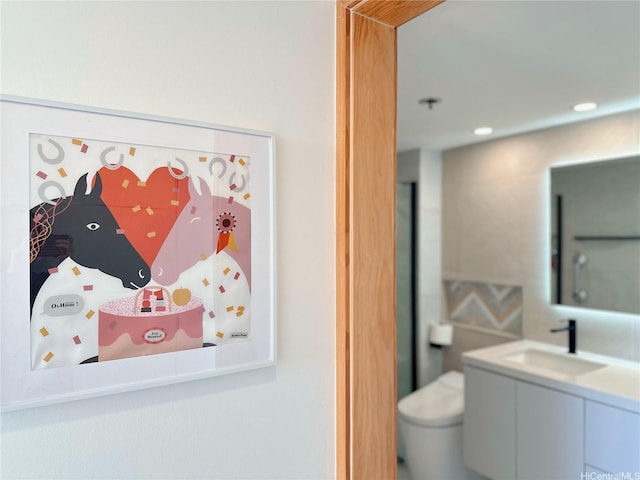 581 Kamoku St Unit 3906, Honolulu, HI 96826 - bathroom featuring vanity, toilet, and recessed lighting