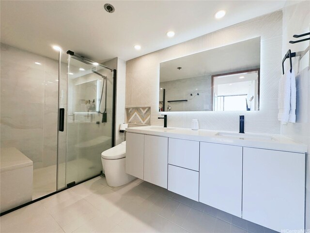 581 Kamoku St Unit 3906, Honolulu, HI 96826 - full bath featuring a shower stall, double vanity, tile walls, toilet, and tile patterned flooring