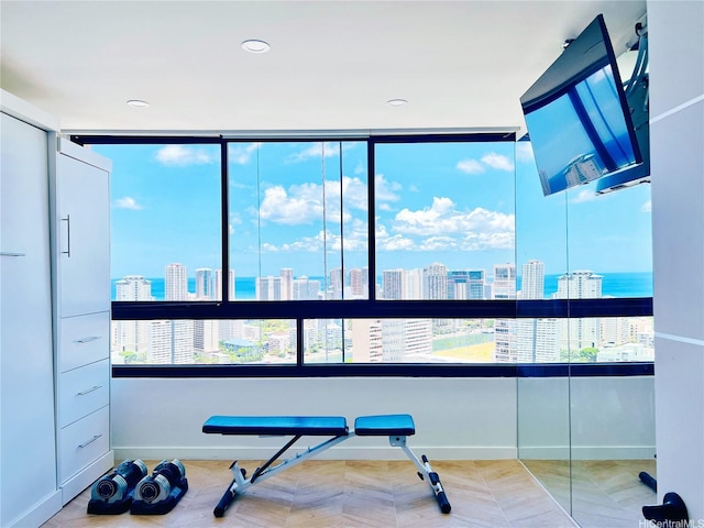 581 Kamoku St Unit 3906, Honolulu, HI 96826 - workout room with a city view, baseboards, and recessed lighting